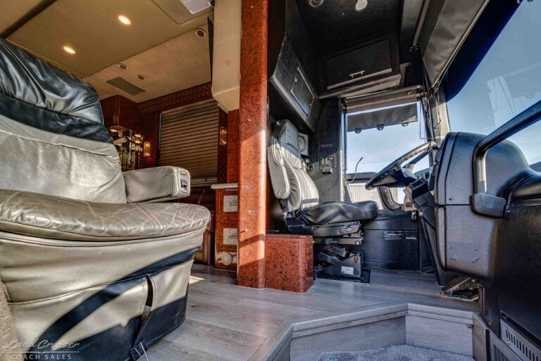 Prevost XLII driver cockpit entry with leather seats and step-up interior view