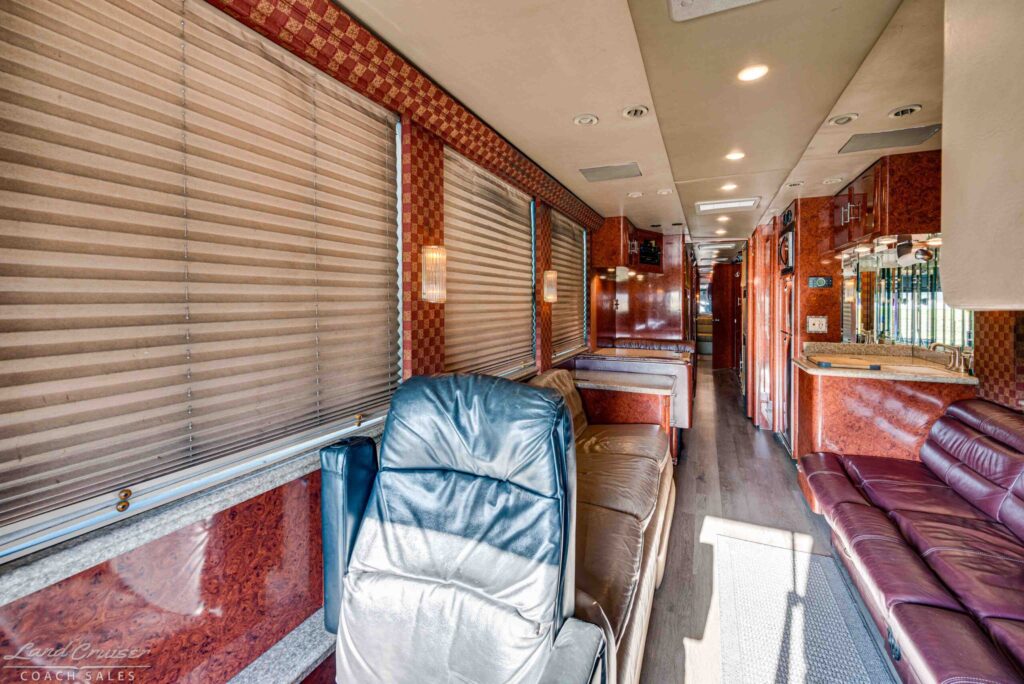 2001 Prevost XLII interior aisle view with leather seating and window shades