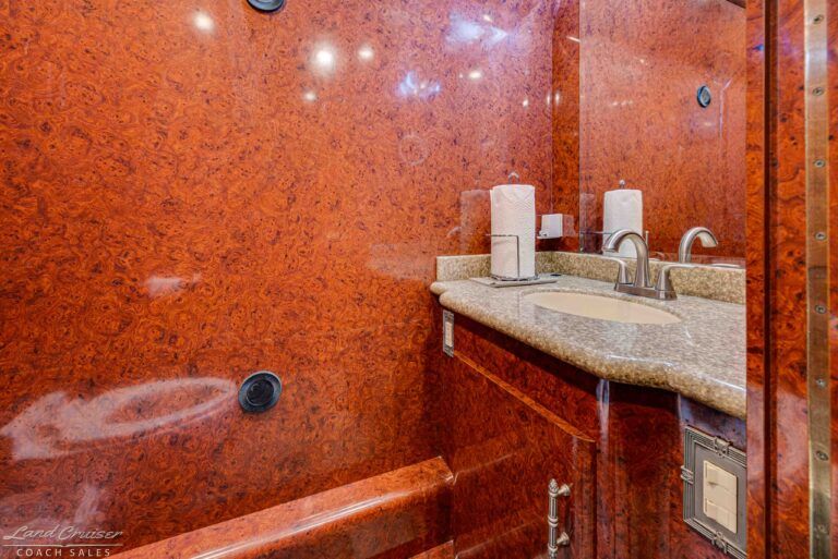Prevost XLII bathroom sink and vanity with solid surface countertop and wood cabinetry