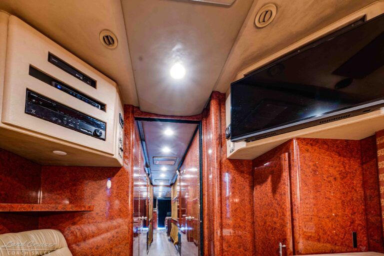 Prevost XLII hallway ceiling and overhead storage with lighting and AV components